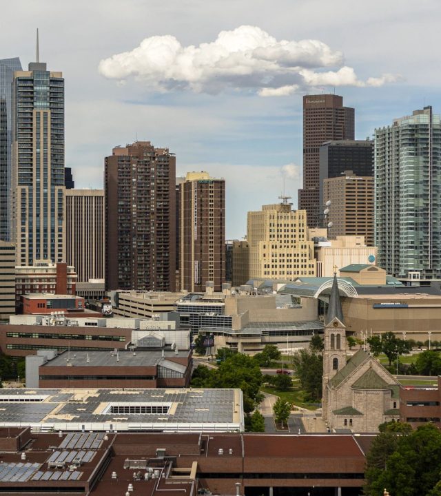 Downtown Denver skyline with modern skyscrapers and commercial buildings view from Mariposa district. Urban development in Colorado's capital city.